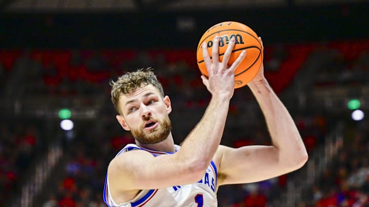 Feb 15, 2025; Salt Lake City, Utah, USA; Kansas Jayhawks center Hunter Dickinson (1) recovers a rebound against the Utah Utes during the second half at the Jon M. Huntsman Center. Mandatory Credit: Christopher Creveling-Imagn Images