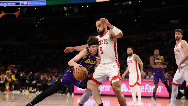 Los Angeles Lakers guard Austin Reaves drives to the basket against Houston Rockets forward Dillon Brooks