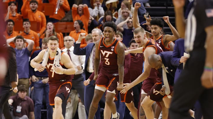 Feb 1, 2025; Charlottesville, Virginia, USA; Virginia Tech Hokies players celebrate after defeating the Virginia Cavaliers at John Paul Jones Arena. Mandatory Credit: Amber Searls-Imagn Images