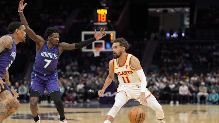 Mar 18, 2025; Charlotte, North Carolina, USA; Atlanta Hawks guard Trae Young (11) handles the ball defended by Charlotte Hornets guard Damion Baugh (7) during second quarter at Spectrum Center. Mandatory Credit: Jim Dedmon-Imagn Images Mar 18, 2025; Charlotte, North Carolina, USA; Atlanta Hawks guard Trae Young (11) handles the ball defended by Charlotte Hornets guard Damion Baugh (7) during second quarter at Spectrum Center. Mandatory Credit: Jim Dedmon-Imagn Images