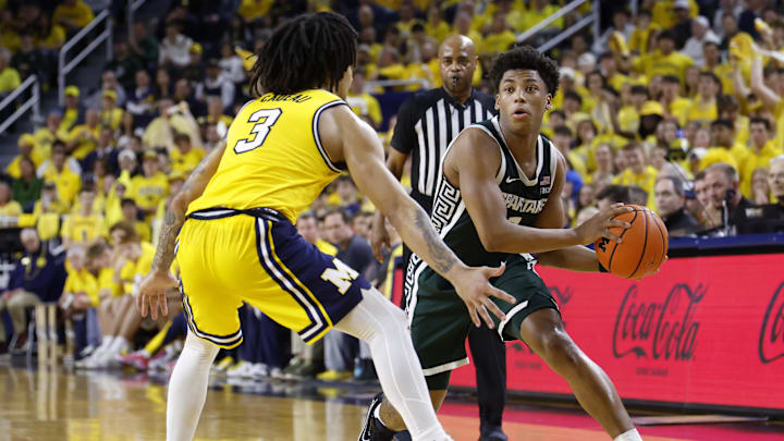 Mar 8, 2026; Ann Arbor, Michigan, USA;  Michigan State Spartans guard Jeremy Fears Jr. (1) dribbles, defended by Michigan Wolverines guard Elliot Cadeau (3).