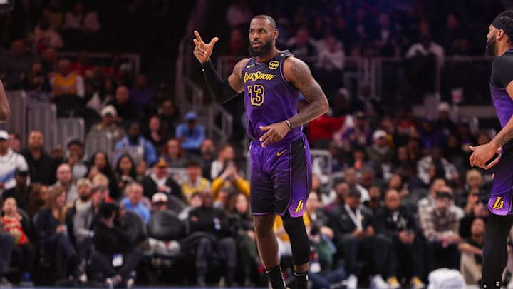 Dec 6, 2024; Atlanta, Georgia, USA; Los Angeles Lakers forward LeBron James (23) reacts after a three point basket against the Atlanta Hawks in the first quarter at State Farm Arena. Mandatory Credit: Brett Davis-Imagn Images