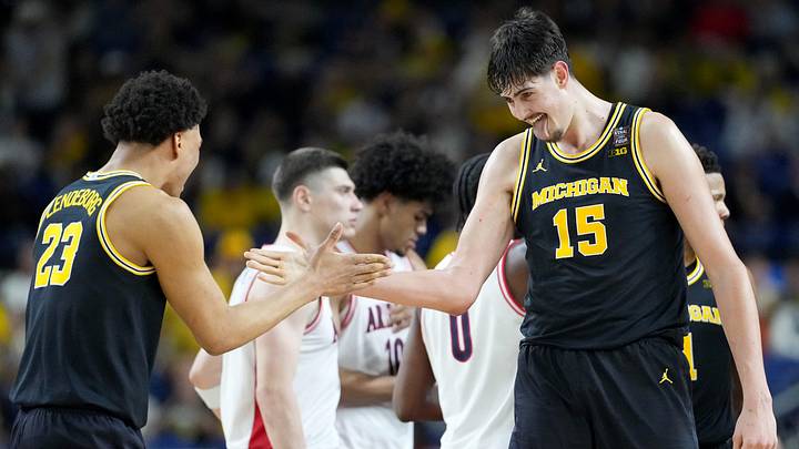 Michigan Wolverines center Aday Mara (15) and forward Yaxel Lendeborg (23) celebrate a made basket Saturday, April 4, 2026, during a Final Four game against the Arizona Wildcats at Lucas Oil Stadium in Indianapolis. Michigan Wolverines center Aday Mara (15) and forward Yaxel Lendeborg (23) celebrate a made basket Saturday, April 4, 2026, during a Final Four game against the Arizona Wildcats at Lucas Oil Stadium in Indianapolis.