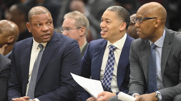 Feb 9, 2020; Cleveland, Ohio, USA; LA Clippers head coach Doc Rivers, left, talks with assistants Tyronn Lue, center, and Sam Cassell in the third quarter against the Cleveland Cavaliers at Rocket Mortgage FieldHouse. Mandatory Credit: David Richard-Imagn Images
