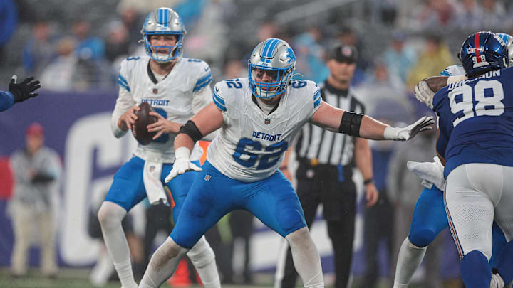 Aug 8, 2024; East Rutherford, New Jersey, USA; Detroit Lions guard Michael Niese (62) blocks in front of quarterback Nate Sudfeld (8) during the first half against the New York Giants at MetLife Stadium. Mandatory Credit: Vincent Carchietta-Imagn Images