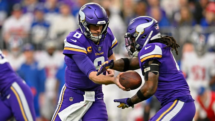 Jan 15, 2023; Minneapolis, Minnesota, USA; Minnesota Vikings quarterback Kirk Cousins (8) hands the