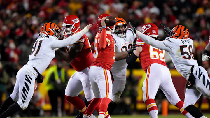 Jan 29, 2023; Kansas City, Missouri, USA;Cincinnati Bengals defensive end Trey Hendrickson (91), defensive tackle BJ Hill (92) and defensive end Joseph Ossai (58) pressure Kansas City Chiefs quarterback Patrick Mahomes (15) in the fourth quarter during the AFC championship NFL game between the Cincinnati Bengals and the Kansas City Chiefs, Sunday, Jan. 29, 2023, at GEHA Field at Arrowhead Stadium in Kansas City, Mo. The Kansas City Chiefs lead the Cincinnati Bengals, 13-6, at halftime. 