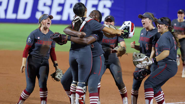 Stanford pitcher NiJaree Canady (24) hugs catcher Aly Kaneshiro (4) as Stanford celebrates after a Women's College World Series softball game between the Stanford Cardinal and the UCLA Bruins at Devon Park in Oklahoma City on Sunday, June 2, 2024. Stanford won 3-1.