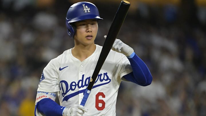 Jul 2, 2025; Los Angeles, California, USA;  Los Angeles Dodgers second baseman Hyeseong Kim (6) checks his bat during the fifth inning against the Chicago White Sox at Dodger Stadium. Mandatory Credit: Jayne Kamin-Oncea-Imagn Images