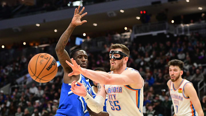 Mar 16, 2025; Milwaukee, Wisconsin, USA; Oklahoma City Thunder center Isaiah Hartenstein (55) passes the ball away from Milwaukee Bucks guard Taurean Prince (12) in the second quarter at Fiserv Forum. Mandatory Credit: Benny Sieu-Imagn Images Mar 16, 2025; Milwaukee, Wisconsin, USA; Oklahoma City Thunder center Isaiah Hartenstein (55) passes the ball away from Milwaukee Bucks guard Taurean Prince (12) in the second quarter at Fiserv Forum. Mandatory Credit: Benny Sieu-Imagn Images