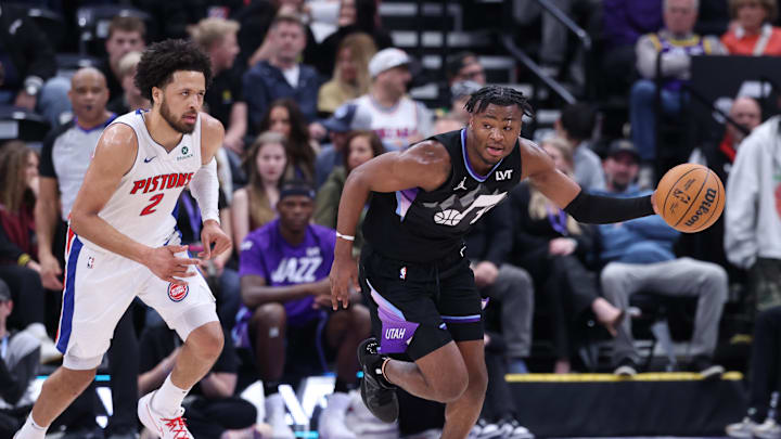 Mar 3, 2025; Salt Lake City, Utah, USA; Utah Jazz guard Isaiah Collier (13) brings the ball up the court with Detroit Pistons guard Cade Cunningham (2) during the second half at Delta Center. Mandatory Credit: Rob Gray-Imagn Images