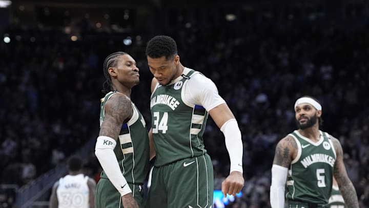 Apr 8, 2025; Milwaukee, Wisconsin, USA; Milwaukee Bucks guard Kevin Porter Jr. (3) and Milwaukee Bucks forward Giannis Antetokounmpo (34) celebrate as the clock winds down in their 110-103 comeback victory over the Minnesota Timberwolves at Fiserv Forum. Mandatory Credit: Michael McLoone-Imagn Images