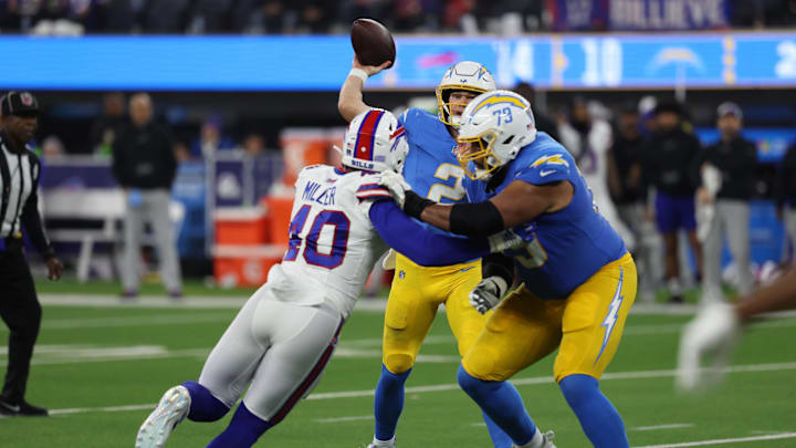 Dec 23, 2023; Inglewood, California, USA; Los Angeles Chargers quarterback Easton Stick (2) throws a pass as offensive tackle Trey Pipkins III (79) blocks Buffalo Bills linebacker Von Miller (40) during the third quarter at SoFi Stadium. Mandatory Credit: Kiyoshi Mio-Imagn Images Dec 23, 2023; Inglewood, California, USA; Los Angeles Chargers quarterback Easton Stick (2) throws a pass as offensive tackle Trey Pipkins III (79) blocks Buffalo Bills linebacker Von Miller (40) during the third quarter at SoFi Stadium. Mandatory Credit: Kiyoshi Mio-Imagn Images
