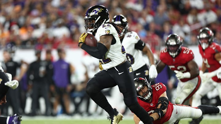 Oct 21, 2024; Tampa, Florida, USA; Baltimore Ravens running back Derrick Henry (22) runs with the ball against the Tampa Bay Buccaneers in the fourth quarter at Raymond James Stadium. Mandatory Credit: Nathan Ray Seebeck-Imagn Images
