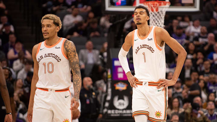 San Antonio Spurs forward Jeremy Sochan (10) and center Victor Wembanyama (1) walk off the court after a time out was called during the fourth quarter at Golden 1 Center. Mandatory Credit: Ed Szczepanski-Imagn Images