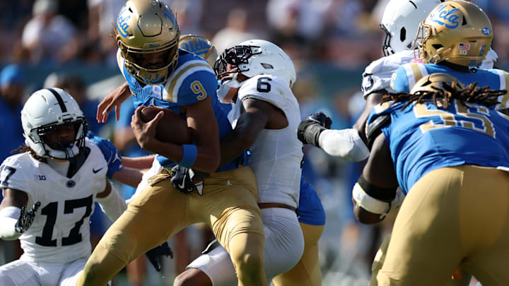 Oct 4, 2025; Pasadena, California, USA; Penn State Nittany Lions safety Zakee Wheatley (6) sacks UCLA Bruins quarterback Nico Iamaleava (9) during the fourth quarter at Rose Bowl. Mandatory Credit: Kiyoshi Mio-Imagn Images