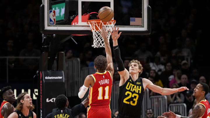 Nov 9, 2022; Atlanta, Georgia, USA; Atlanta Hawks guard Trae Young (11) shoots over Utah Jazz forward Lauri Markkanen (23) during the second half at State Farm Arena. Mandatory Credit: Dale Zanine-USA TODAY Sports
