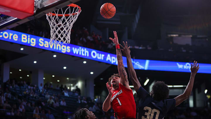 Feb 1, 2025; Atlanta, Georgia, USA; Louisville Cardinals guard J'Vonne Hadley (1) shoots against the Georgia Tech Yellow Jackets in the first half at McCamish Pavilion. Mandatory Credit: Brett Davis-Imagn Images