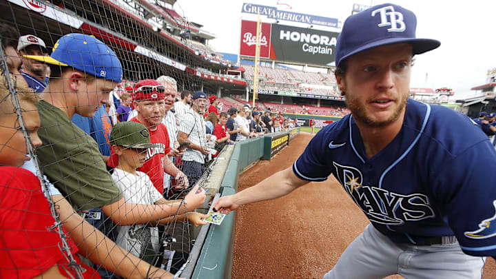 Jul 8, 2022; Cincinnati, Ohio, USA; Tampa Bay Rays outfielder Brett Phillips (35) runs back to the dugout after signing autographs prior to a game with the Cincinnati Reds at Great American Ball Park. Mandatory Credit: David Kohl-Imagn Images Jul 8, 2022; Cincinnati, Ohio, USA; Tampa Bay Rays outfielder Brett Phillips (35) runs back to the dugout after signing autographs prior to a game with the Cincinnati Reds at Great American Ball Park. Mandatory Credit: David Kohl-Imagn Images