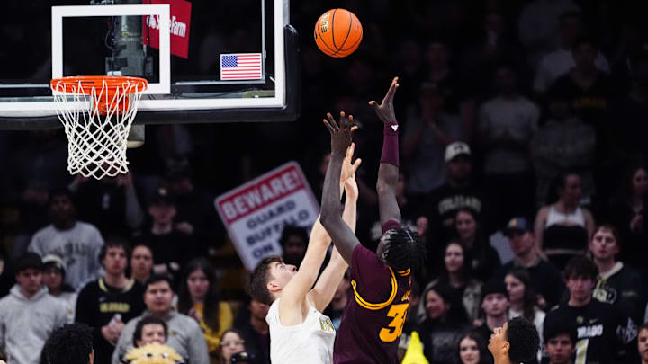 Feb 7, 2026; Boulder, Colorado, USA; Arizona State Sun Devils center Massamba Diop (35) shoots the ball over Colorado Buffaloes forward Sebastian Rancik (7) in the second half at the CU Events Center. Mandatory Credit: Ron Chenoy-Imagn Images