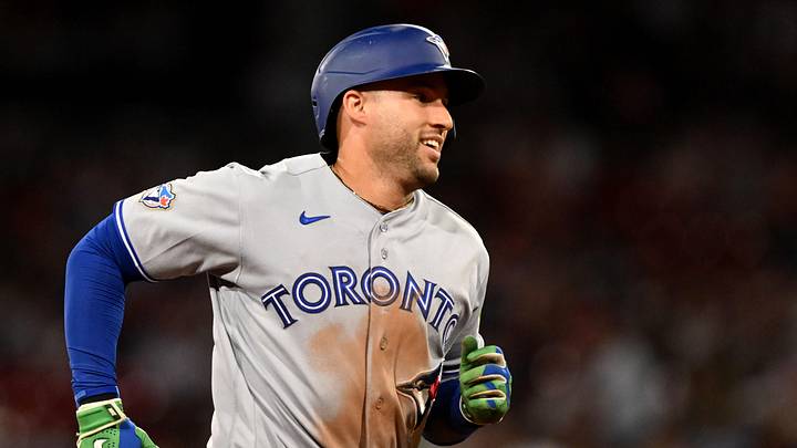 Blue Jays designated hitter George Springer (4) reacts after hitting a home run against the Boston Red Sox during the ninth inning at Fenway Park. Blue Jays designated hitter George Springer (4) reacts after hitting a home run against the Boston Red Sox during the ninth inning at Fenway Park.