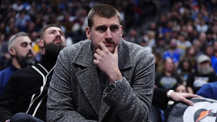 Jan 18, 2026; Denver, Colorado, USA; Denver Nuggets center Nikola Jokic (15) on the bench in the third quarter against the Charlotte Hornets at Ball Arena. Mandatory Credit: Ron Chenoy-Imagn Images