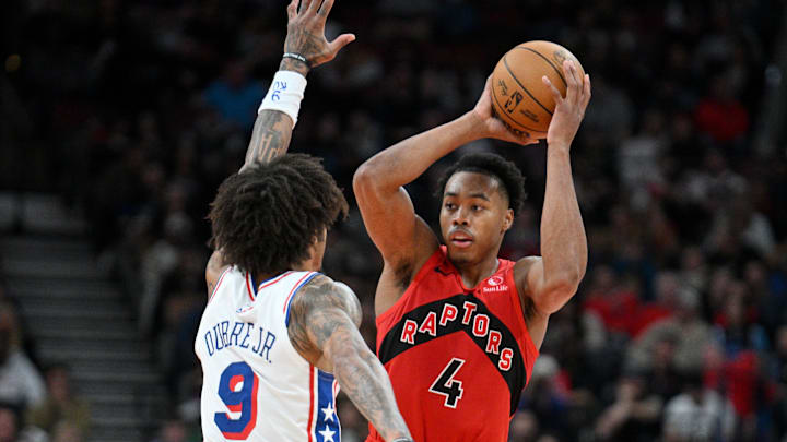 Oct 25, 2024; Toronto, Ontario, CAN;   Toronto Raptors forward Scottie Barnes (4) looks to make a pass as Philadelphia 76ers forward Kelly Oubre Jr. (9) defends in the second half at Scotiabank Arena. Mandatory Credit: Dan Hamilton-Imagn Images