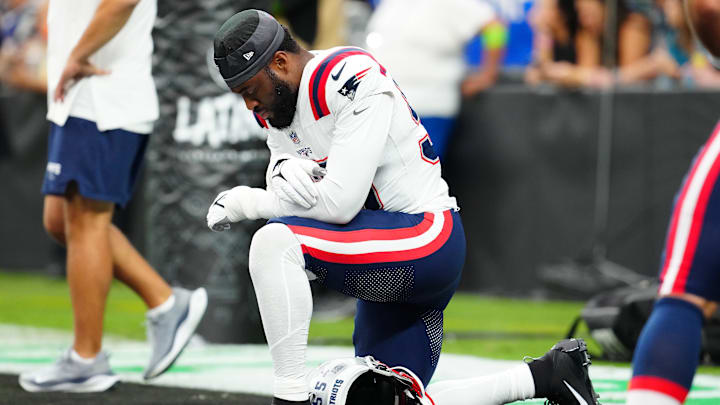 Oct 15, 2023; Paradise, Nevada, USA; New England Patriots linebacker Josh Uche (55) prays before the start of a game against the Las Vegas Raiders at Allegiant Stadium. Mandatory Credit: Stephen R. Sylvanie-Imagn Images