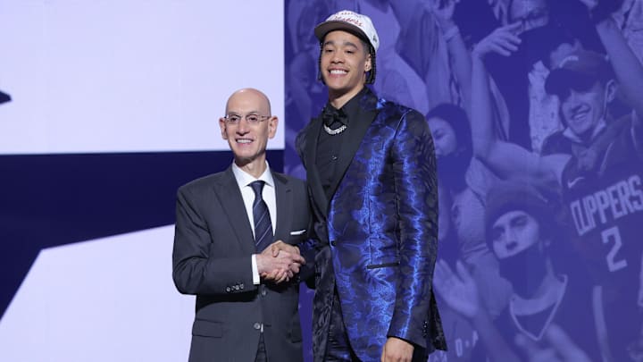 Jun 25, 2025; Brooklyn, NY, USA;  Yanic Konan Niederhauser stands with NBA commissioner Adam Silver after being selected as the 30th pick by the Los Angeles Clippers in the first round of the 2025 NBA Draft at Barclays Center. Mandatory Credit: Brad Penner-Imagn Images