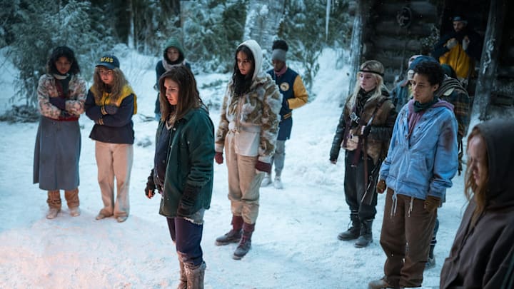 (L-R): Nuha Jes Izman as Teen Crystal, Samantha Hanratty as Teen Misty, Alexa Barajas as Teen Mari, Sophie Nélisse as Teen Shauna, Courtney Eaton as Teen Lottie, Nia Sondaya as Teen Akilah, Sophie Thatcher as Teen Natalie, Jasmin Savoy Brown as Teen Taissa, Steven Krueger as Ben Scott and Liv Hewson as Teen Van in YELLOWJACKETS, Season 2. Photo Credit: Kailey Schwerman/SHOWTIME.