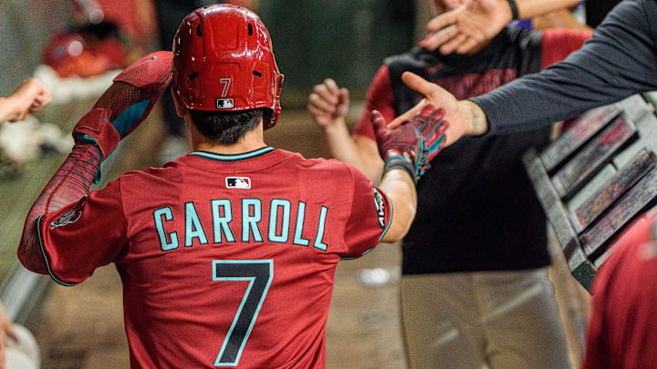 Sep 21, 2025; Phoenix, Arizona, USA; Arizona Diamondbacks outfielder Corbin Carroll (7) celebreats with his team after scoring in the eighth inning against the Philadelphia Phillies at Chase Field. Mandatory Credit: Allan Henry-Imagn Images Sep 21, 2025; Phoenix, Arizona, USA; Arizona Diamondbacks outfielder Corbin Carroll (7) celebreats with his team after scoring in the eighth inning against the Philadelphia Phillies at Chase Field. Mandatory Credit: Allan Henry-Imagn Images