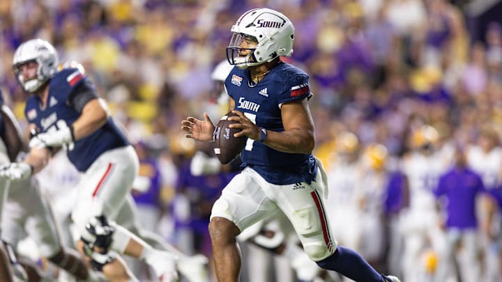 Sep 28, 2024; Baton Rouge, Louisiana, USA;  South Alabama Jaguars quarterback Gio Lopez (7) rolls out against the LSU Tigers during the second quarter at Tiger Stadium. 
