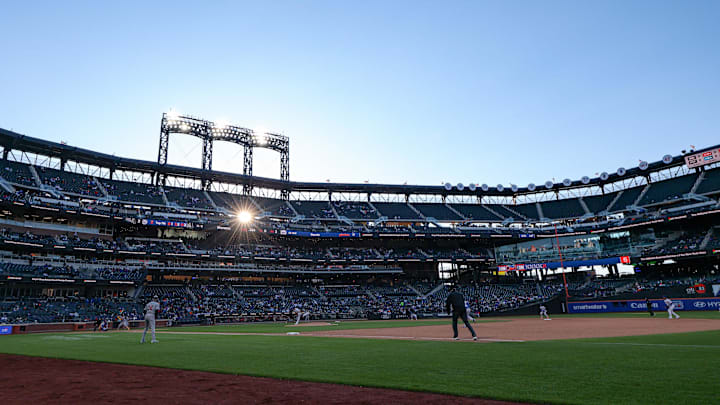 Apr 7, 2026; New York City, New York, USA; The sun shines behind the lights at Citi Field during the seventh inning between the New York Mets and the Arizona Diamondbacks. Mandatory Credit: Vincent Carchietta-Imagn Images