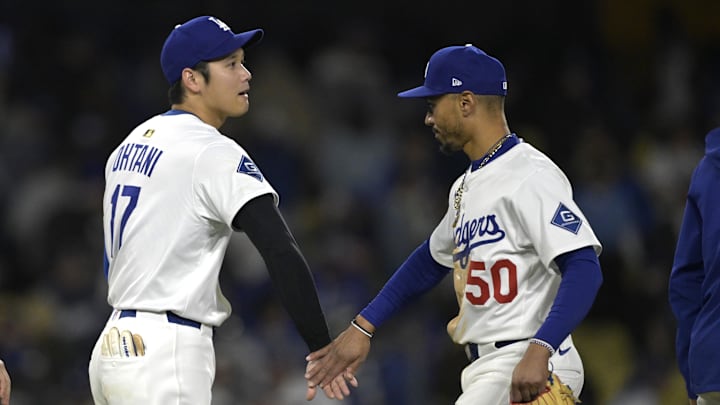 Los Angeles, California, USA;  Los Angeles Dodgers designated hitter Shohei Ohtani (17) and shortstop Mookie Betts (50) head off the field following the game against the Colorado Rockies at Dodger Stadium.