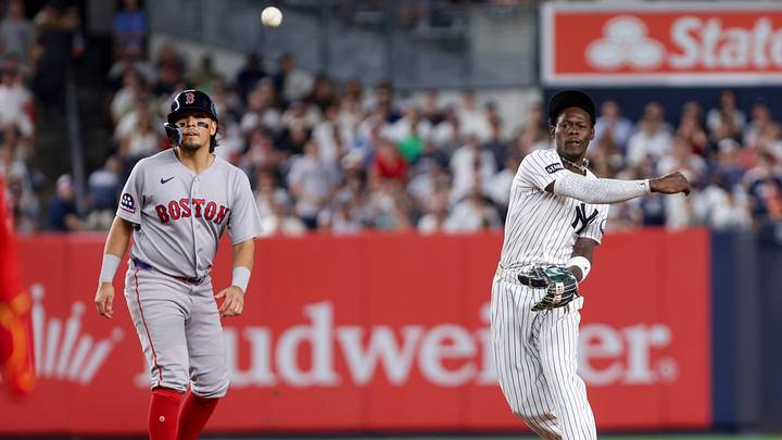 New York Yankees second baseman Jazz Chisholm Jr. throws to first for a double play against the Boston Red Sox.