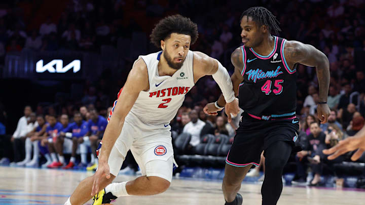 Nov 29, 2025; Miami, Florida, USA; Detroit Pistons guard Cade Cunningham (2) drives to the basket against Miami Heat guard Davion Mitchell (45) during the second half at Kaseya Center. Mandatory Credit: Rhona Wise-Imagn Images