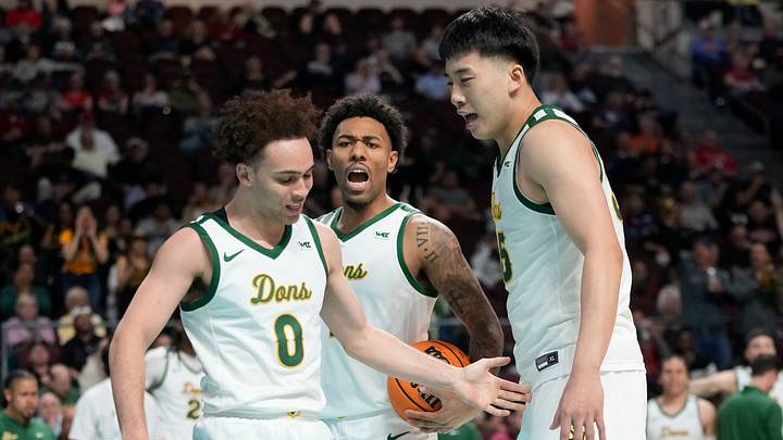 San Francisco guard Ryan Beasley (0), now with the Huskies, celebrates with his former teammates. San Francisco guard Ryan Beasley (0), now with the Huskies, celebrates with his former teammates.