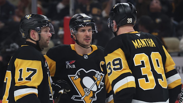 Dec 9, 2025; Pittsburgh, Pennsylvania, USA;  Pittsburgh Penguins right wing Bryan Rust (17) and center Sidney Crosby (87) and right wing Anthony Mantha (39) talk on the ice against the Anaheim Ducks during the second period at PPG Paints Arena. Mandatory Credit: Charles LeClaire-Imagn Images