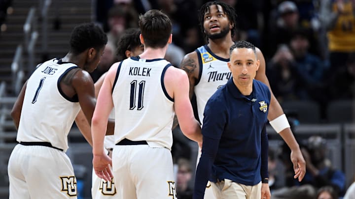 Mar 22, 2024; Indianapolis, IN, USA; Marquette Golden Eagles head coach Shaka Smart and team.