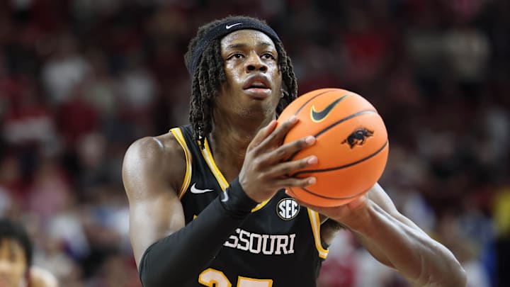 Feb 22, 2025; Fayetteville, Arkansas, USA; Missouri Tigers forward Mark Mitchell (25) shoots a free throw during the second half against the Arkansas Razorbacks at Bud Walton Arena. Mandatory Credit: Nelson Chenault-Imagn Images