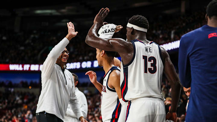 Gonzaga assistant coach R-Jay Barsh high fives senior forward Graham Ike.