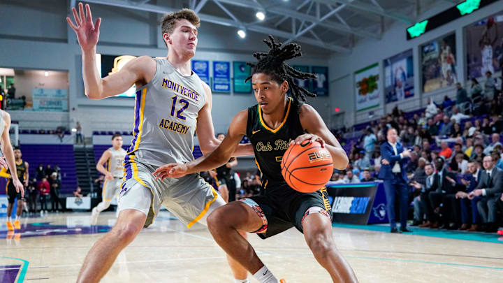 Oak Ridge Pioneers guard Will Jackson (3) drives to the basket as Montverde Academy Eagles forward Trent Sisley (12) guards him during the first quarter of the City of Palms Classic semifinal game at Suncoast Credit Union Arena in Fort Myers, Fla., on Saturday, Dec. 21, 2024.