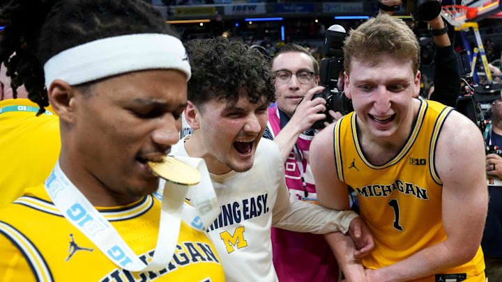 Michigan Wolverines players react after they defeat the Wisconsin Badgers during the 2025 TIAA Big Ten Men’s Basketball Tournament final game on Sunday, March 16, 2025, at Gainbridge Fieldhouse in Indianapolis. Michigan defeated Wisconsin 59-53. Michigan Wolverines players react after they defeat the Wisconsin Badgers during the 2025 TIAA Big Ten Men’s Basketball Tournament final game on Sunday, March 16, 2025, at Gainbridge Fieldhouse in Indianapolis. Michigan defeated Wisconsin 59-53.