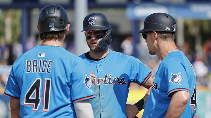 Port St. Lucie, Florida, USA; Miami Marlins third baseman Connor Norby talks with first baseman Jonah Bride and third base coach Blake Lalli during a New York Mets pithing change in the fourth inning at Clover Park. Port St. Lucie, Florida, USA; Miami Marlins third baseman Connor Norby talks with first baseman Jonah Bride and third base coach Blake Lalli during a New York Mets pithing change in the fourth inning at Clover Park.