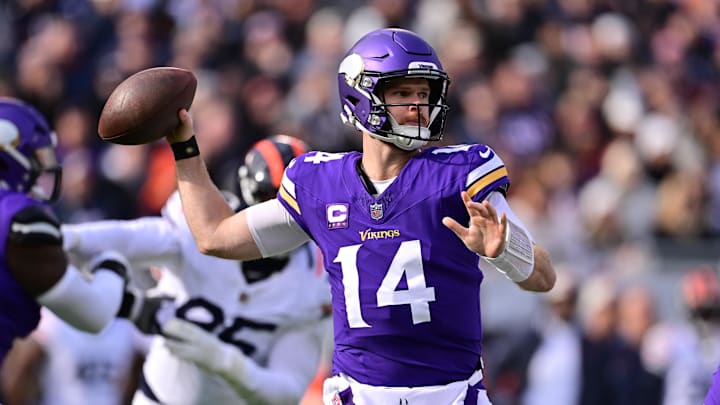 Nov 24, 2024; Chicago, Illinois, USA; Minnesota Vikings quarterback Sam Darnold (14) passes the ball against the Chicago Bears during the first quarter at Soldier Field. Mandatory Credit: Daniel Bartel-Imagn Images