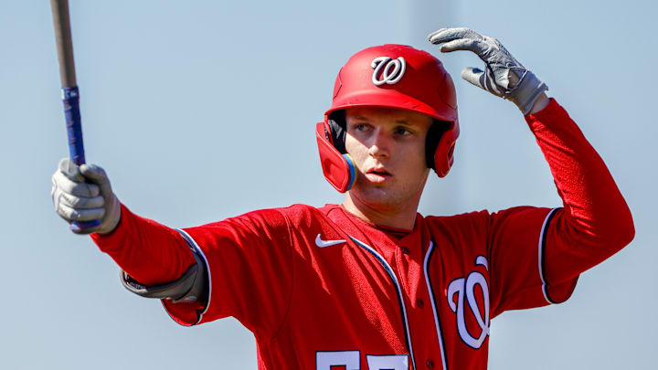 Feb 20, 2023; West Palm Beach, FL, USA; Washington Nationals outfielder Robert Hassell III (55) practices his swing during a spring training workout at The Ballpark of the Palm Beaches. 