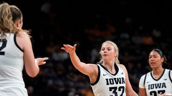 Iowa guard Callie Levin (32) reaches to high-five Iowa center Layla Hays (12) Nov. 9, 2025 during a women’s basketball game against the Evansville Purple Aces at Carver-Hawkeye Arena in Iowa City, Iowa. Iowa guard Callie Levin (32) reaches to high-five Iowa center Layla Hays (12) Nov. 9, 2025 during a women’s basketball game against the Evansville Purple Aces at Carver-Hawkeye Arena in Iowa City, Iowa.