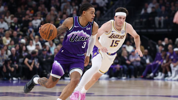 Nov 23, 2025; Salt Lake City, Utah, USA; Utah Jazz guard Keyonte George (3) moves the ball against Los Angeles Lakers guard Austin Reaves (15) during the second half at Delta Center. Mandatory Credit: Rob Gray-Imagn Images