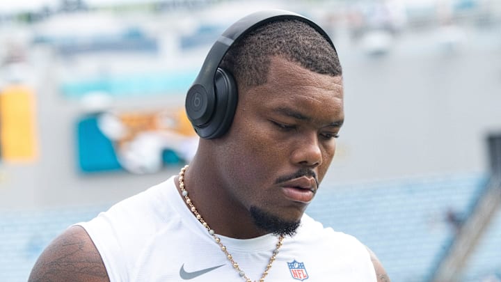 Jacksonville Jaguars defensive end Travon Walker (44) walks the field while listening to music before an NFL game between the Carolina Panthers at Jacksonville Jaguars at EverBank Stadium Sunday September 7, 2025. [Doug Engle/Florida Times-Union]