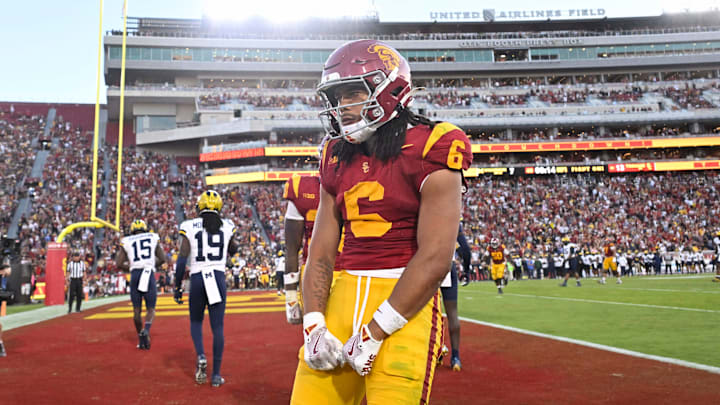 USC Trojans defeated the Michigan Wolverines 31-13 to win a NCAA football game.